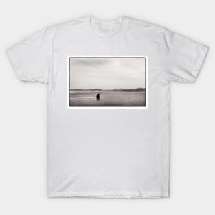 A couple embrace on the beach at Alnmouth, Northumberland, UK T-Shirt